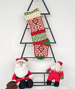 Hand-knitted multicolor traditional Christmas stocking with rich pattern.
