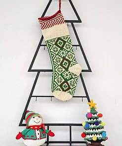Personalized green knitted Christmas stocking with traditional Bosnian pattern