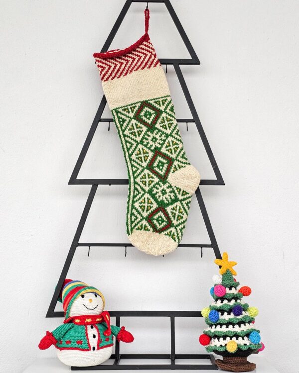 Personalized green knitted Christmas stocking with traditional Bosnian pattern