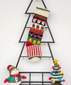 Personalized hand-knitted Christmas stocking with Santa and gift patterns.
