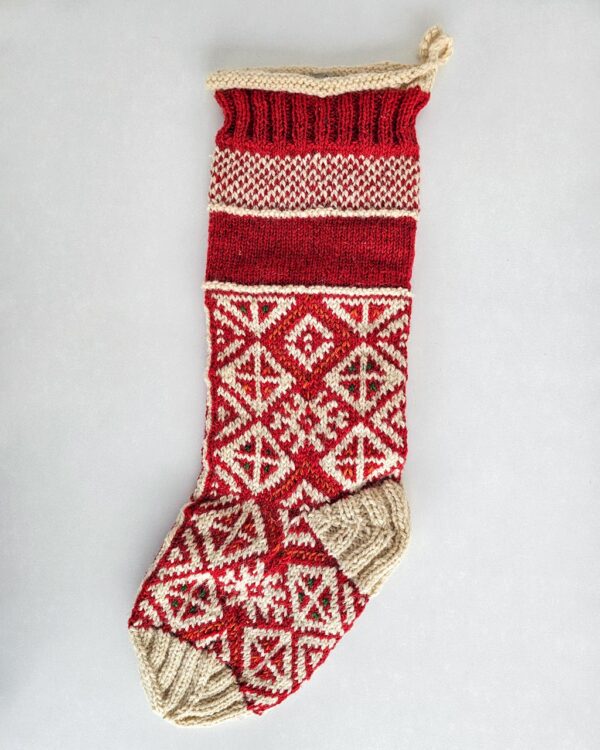 Hand-knitted red Christmas stocking with traditional Bosnian pattern, personalized name.