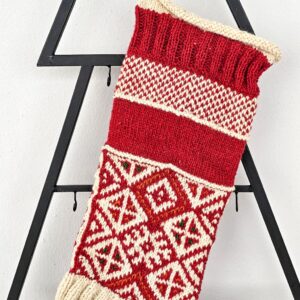 Hand-knitted red Christmas stocking with traditional pattern