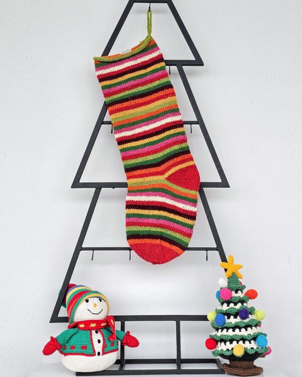 Hand-knit striped Christmas stocking in vivid multicolor