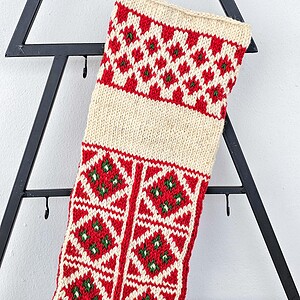 Hand-knitted red and green Christmas stocking with name embroidery from BHcrafts