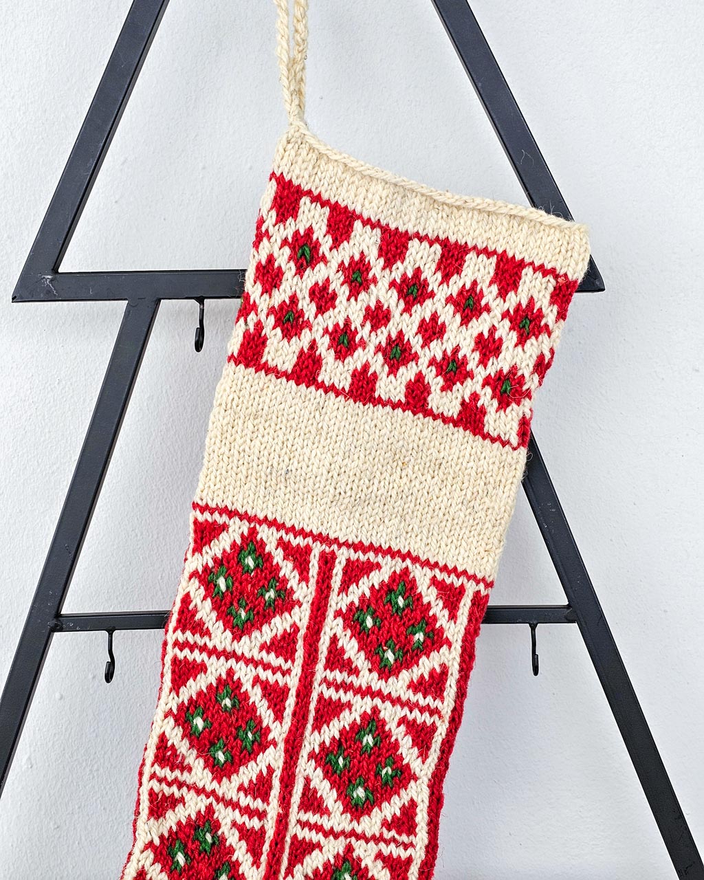 Hand-knitted red and green Christmas stocking with name embroidery from BHcrafts