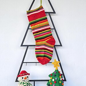 Hand-knit personalized striped Christmas stocking in vivid multicolor