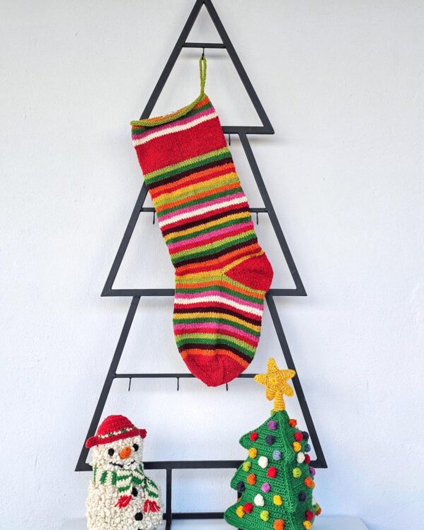 Hand-knit personalized striped Christmas stocking in vivid multicolor