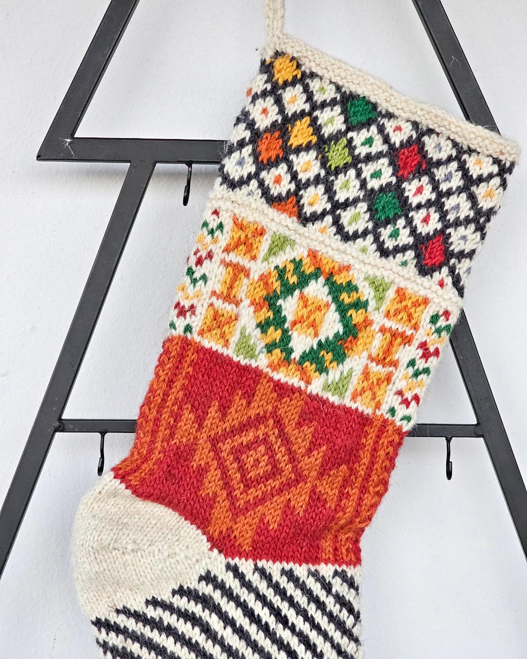 Close-up of the handmade Christmas stocking top with detailed artisan stitching