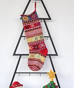Handmade red traditional Christmas stocking in sustainable wool