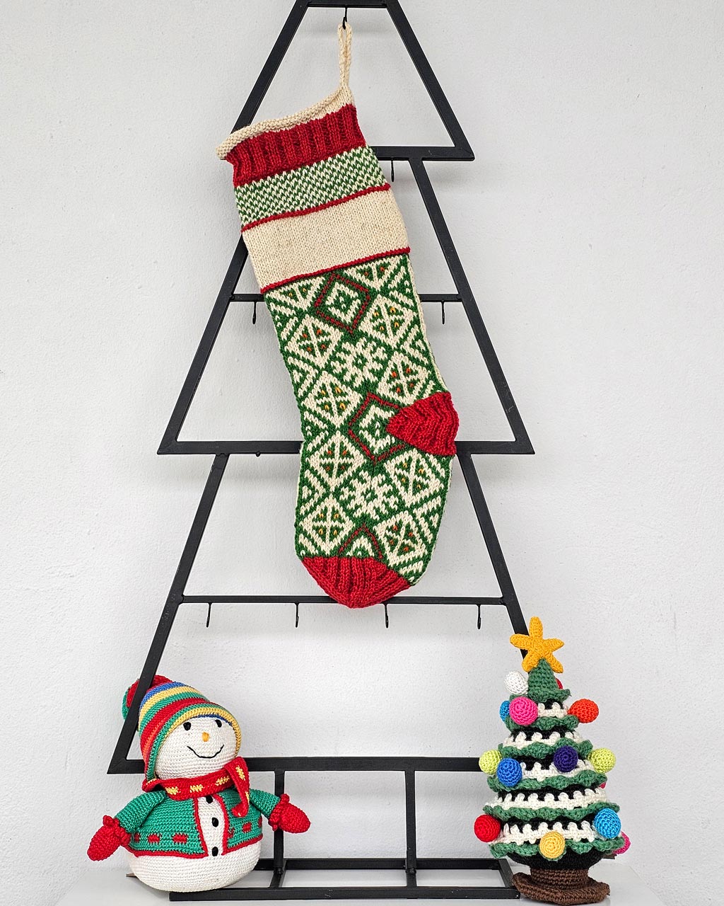 Ethically made knitted Christmas stocking with traditional Bosnian design and custom name option.