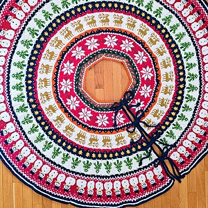 Festive tree skirt with snowmen and reindeer pattern